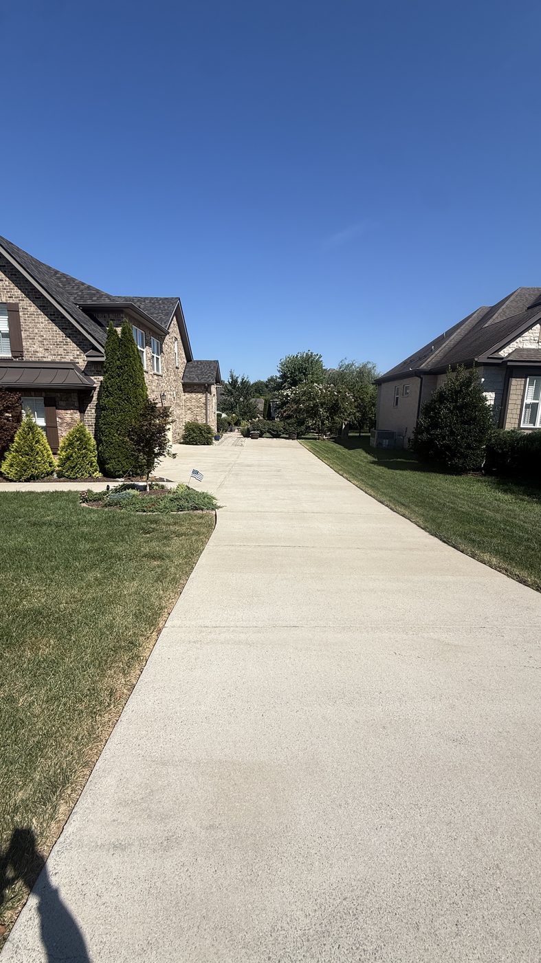 Driveway after pressure washing, light and clean